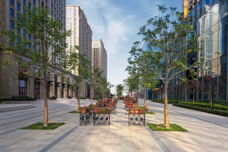 concrete footpath in the city through commercial buildings