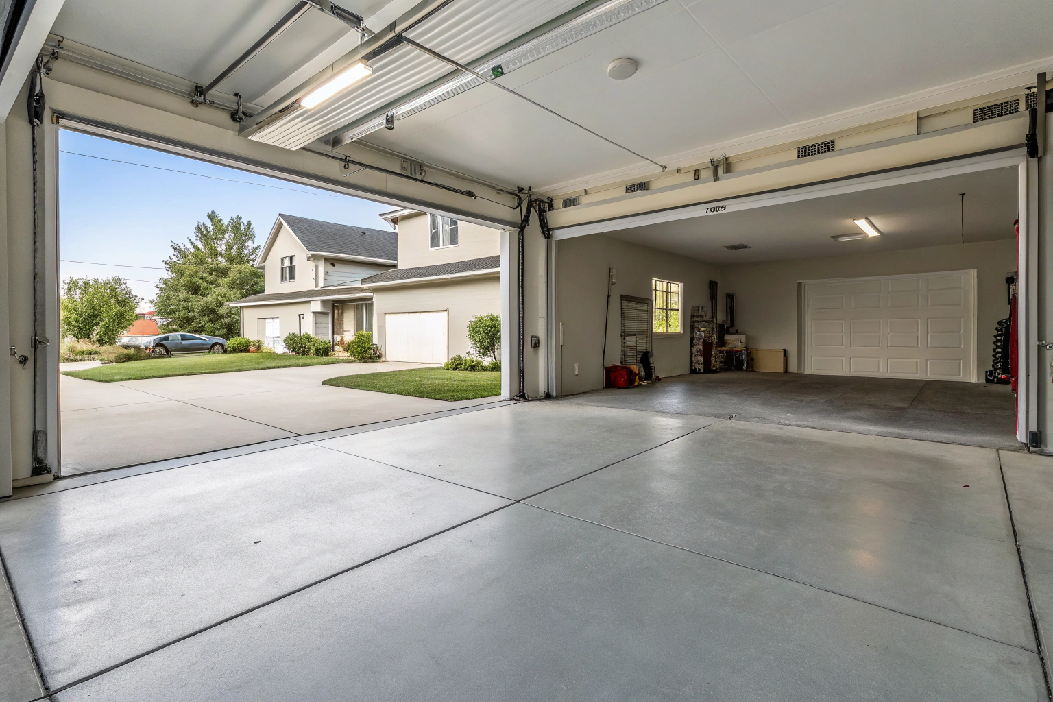 Clean concrete garage floor inside residential double garage